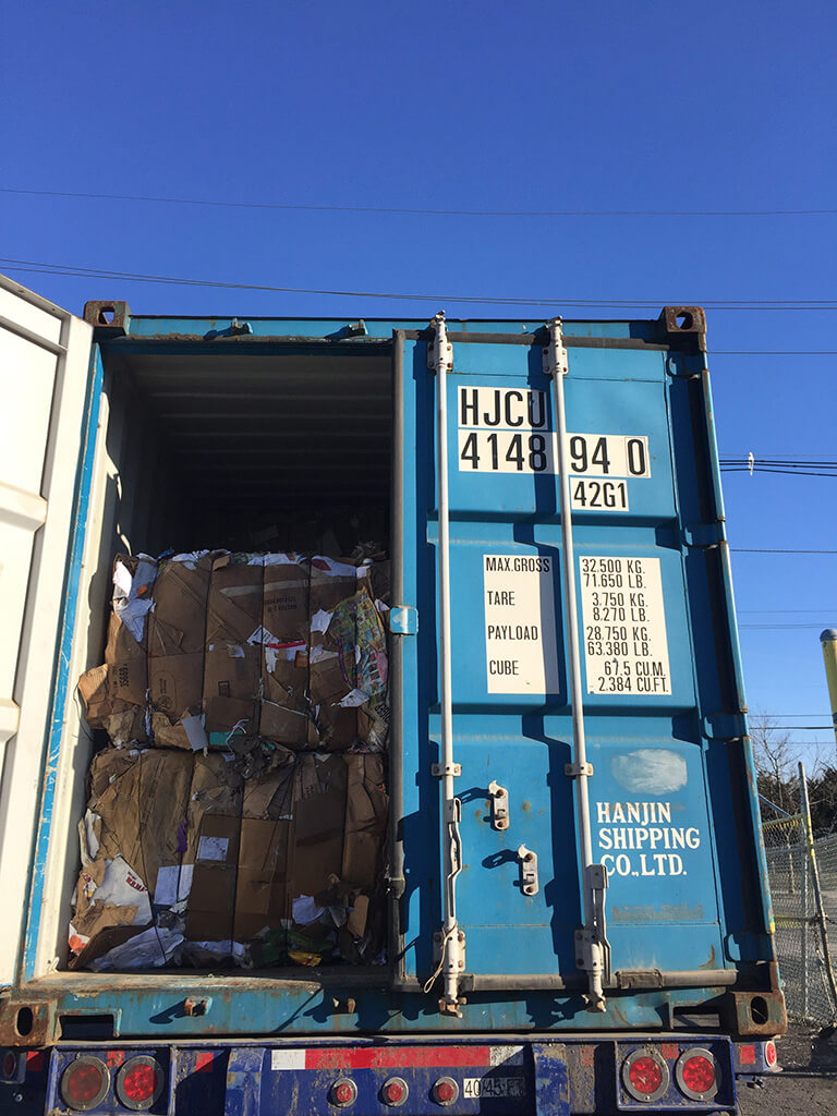 A pile of recycled paper in a container van